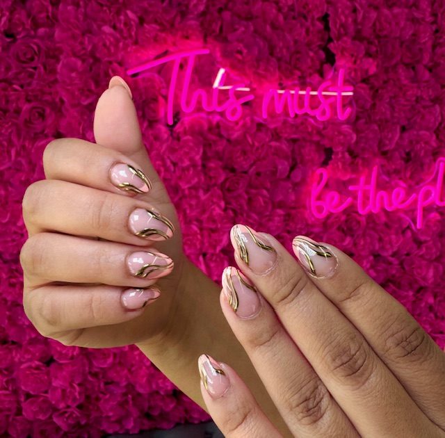 Sheer nude almonds with gold chrome swirls nails at Modish Nail Lounge Rancho Cucamonga