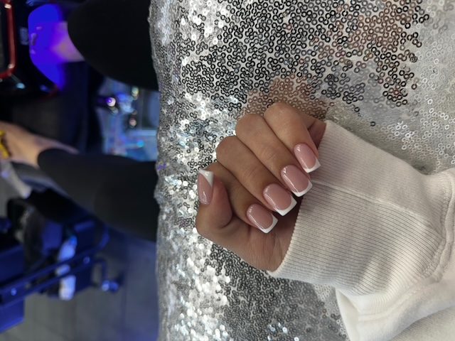 Classic white French on a sequin set nails at Modish Nail Lounge Rancho Cucamonga