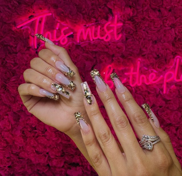 Milky nude with gold foil and glitter nails at Modish Nail Lounge Rancho Cucamonga