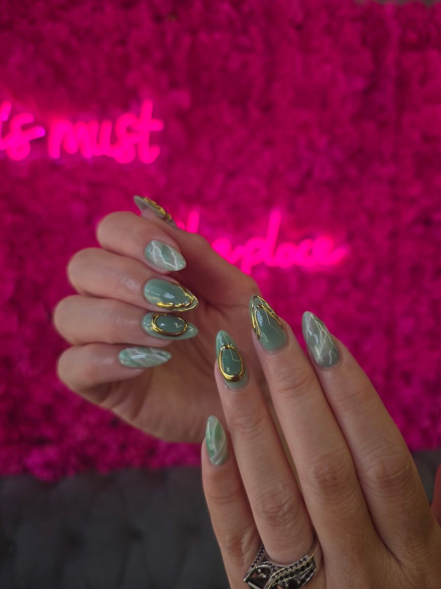 Jade-green marble with gold bezel accents nails at Modish Nail Lounge Rancho Cucamonga