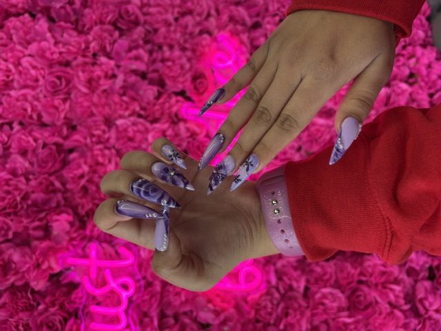 Lavender marble with 3D butterflies and rhinestones nails at Modish Nail Lounge Rancho Cucamonga