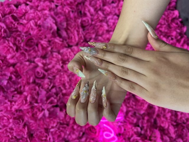 Gold-leaf and feather marble nails at Modish Nail Lounge Rancho Cucamonga