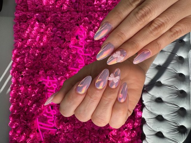 Lavender opal chrome with white 3D flowers nails at Modish Nail Lounge Rancho Cucamonga