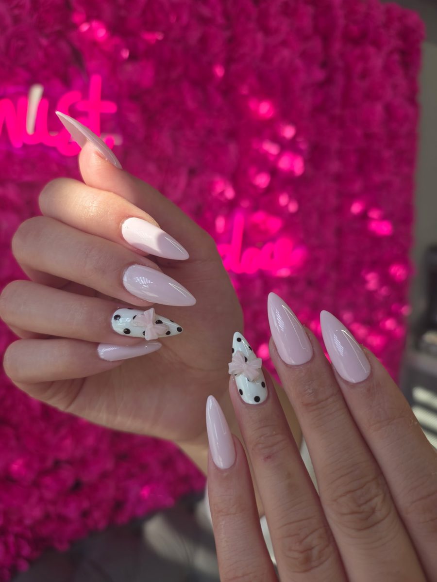 Milky pink with polka-dot accents and pink 3D bows nails at Modish Nail Lounge Rancho Cucamonga