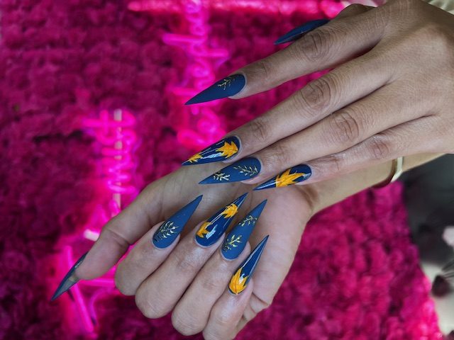 Navy matte with gold floral and gold leaf nails at Modish Nail Lounge Rancho Cucamonga