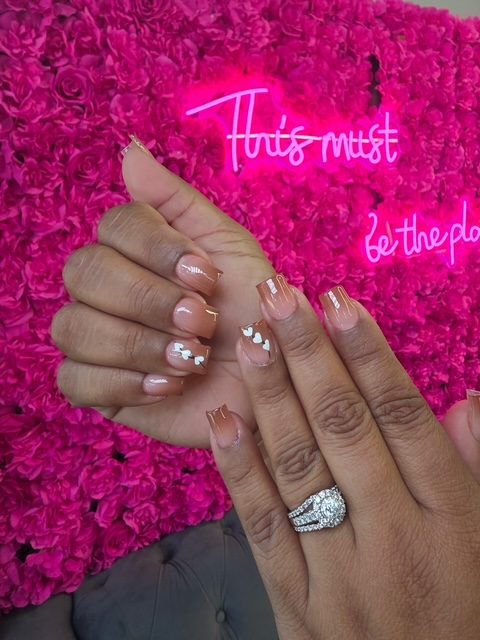 Sheer nude with white hearts and silver glitter nails at Modish Nail Lounge Rancho Cucamonga