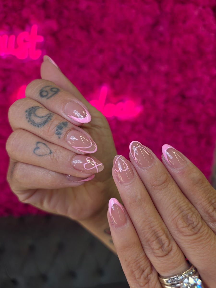 Sheer nude with pink swirl French and hearts nails at Modish Nail Lounge Rancho Cucamonga