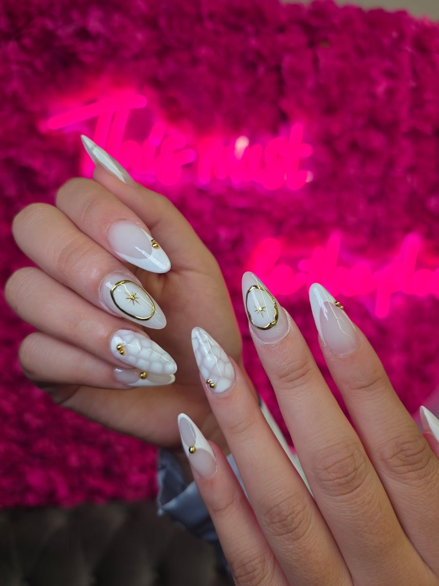 White & gold compass-star with marble detail nails at Modish Nail Lounge Rancho Cucamonga