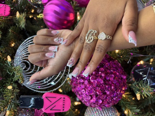 White French with silver chrome swirls and 3D bow nails at Modish Nail Lounge Rancho Cucamonga