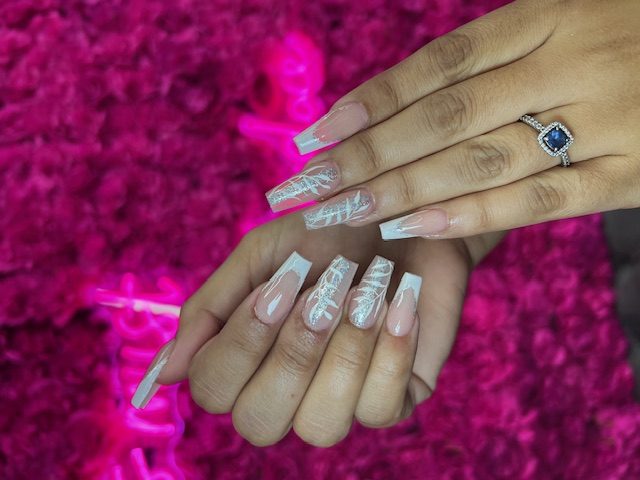 White French with silver palm-leaf art nails at Modish Nail Lounge Rancho Cucamonga