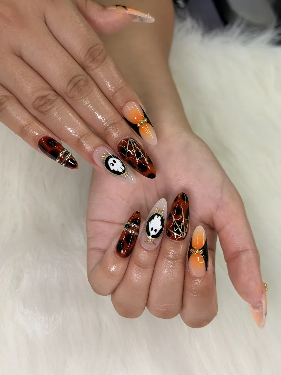Tortoiseshell almonds with gold spiderwebs and ghost cameo nails at Modish Nail Lounge Rancho Cucamonga