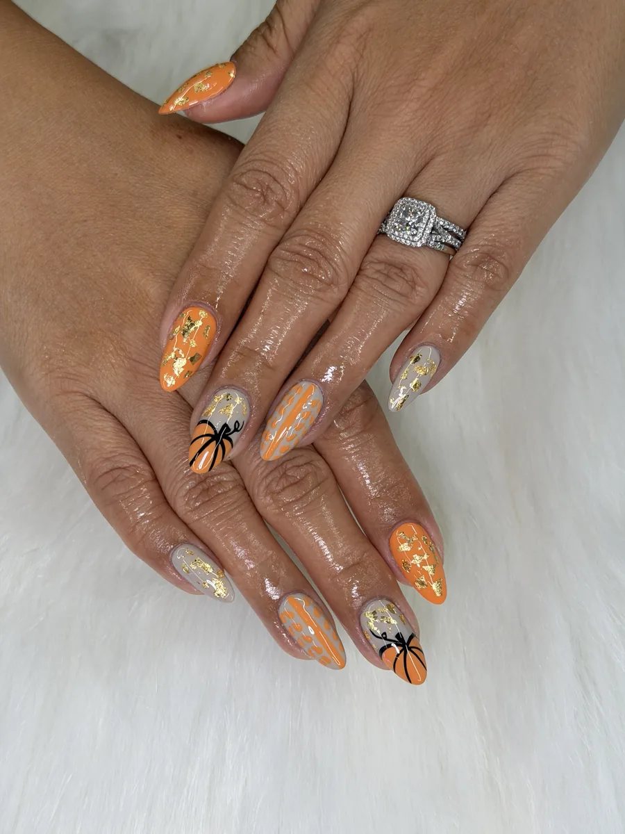 Pumpkin orange and greige with gold foil and 3D pumpkins nails at Modish Nail Lounge Rancho Cucamonga