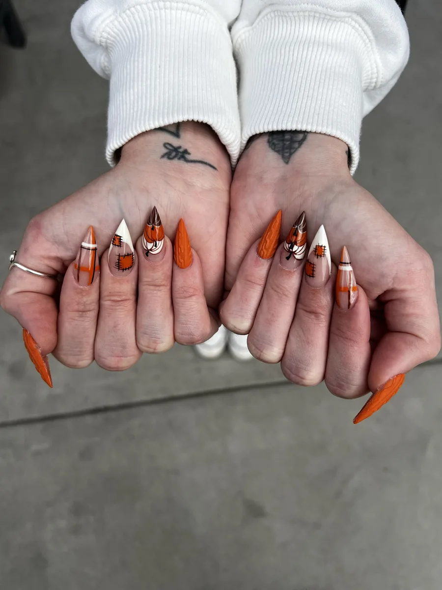 Burnt orange stilettos with pumpkins, plaid and patchwork nails at Modish Nail Lounge Rancho Cucamonga