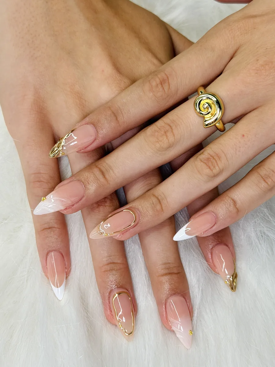 Nude almonds with molten gold linework and French tips nails at Modish Nail Lounge Rancho Cucamonga