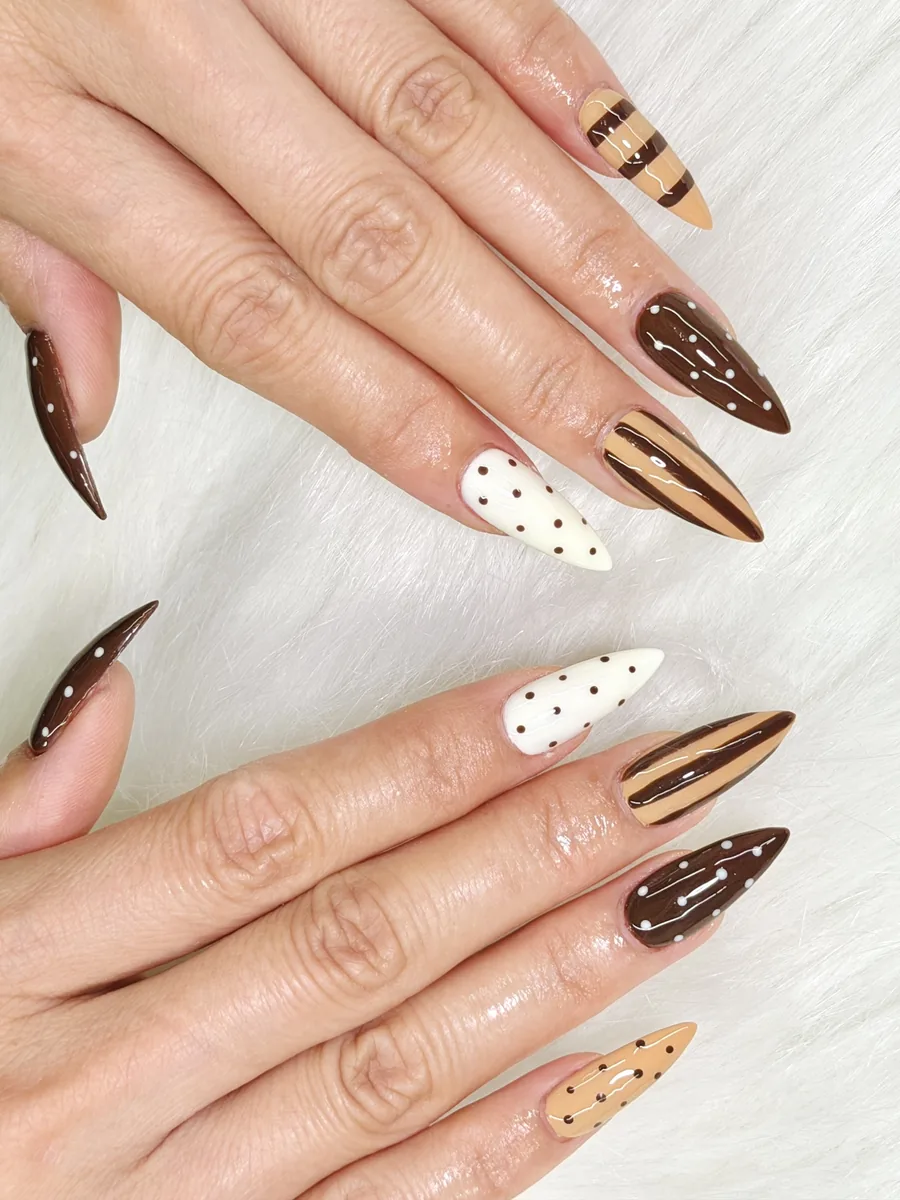 Caramel and cream stripes with polka-dot accents nails at Modish Nail Lounge Rancho Cucamonga