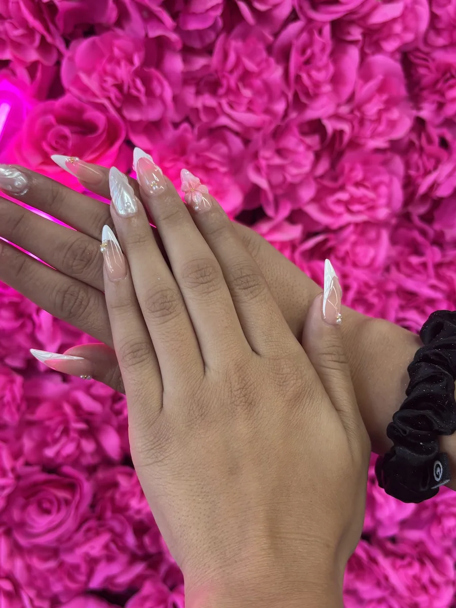 Pearl chrome with soft white swirl detail nails at Modish Nail Lounge Rancho Cucamonga