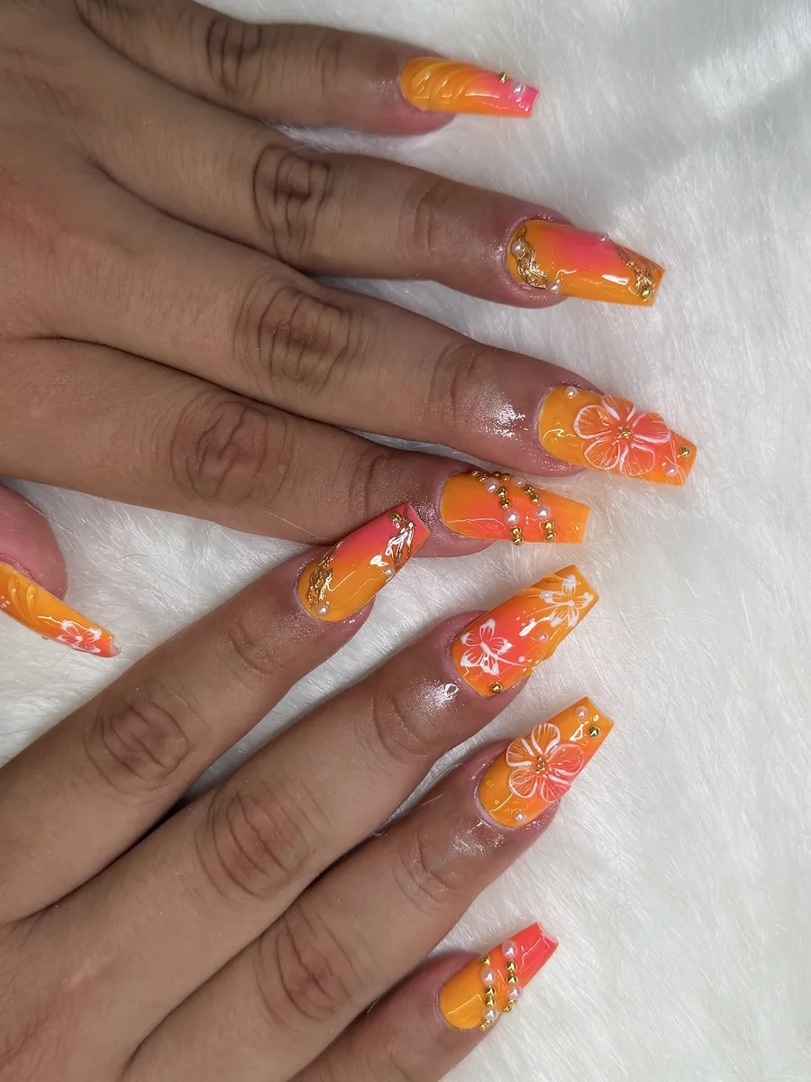 Orange and pink ombre with floral art nails at Modish Nail Lounge Rancho Cucamonga