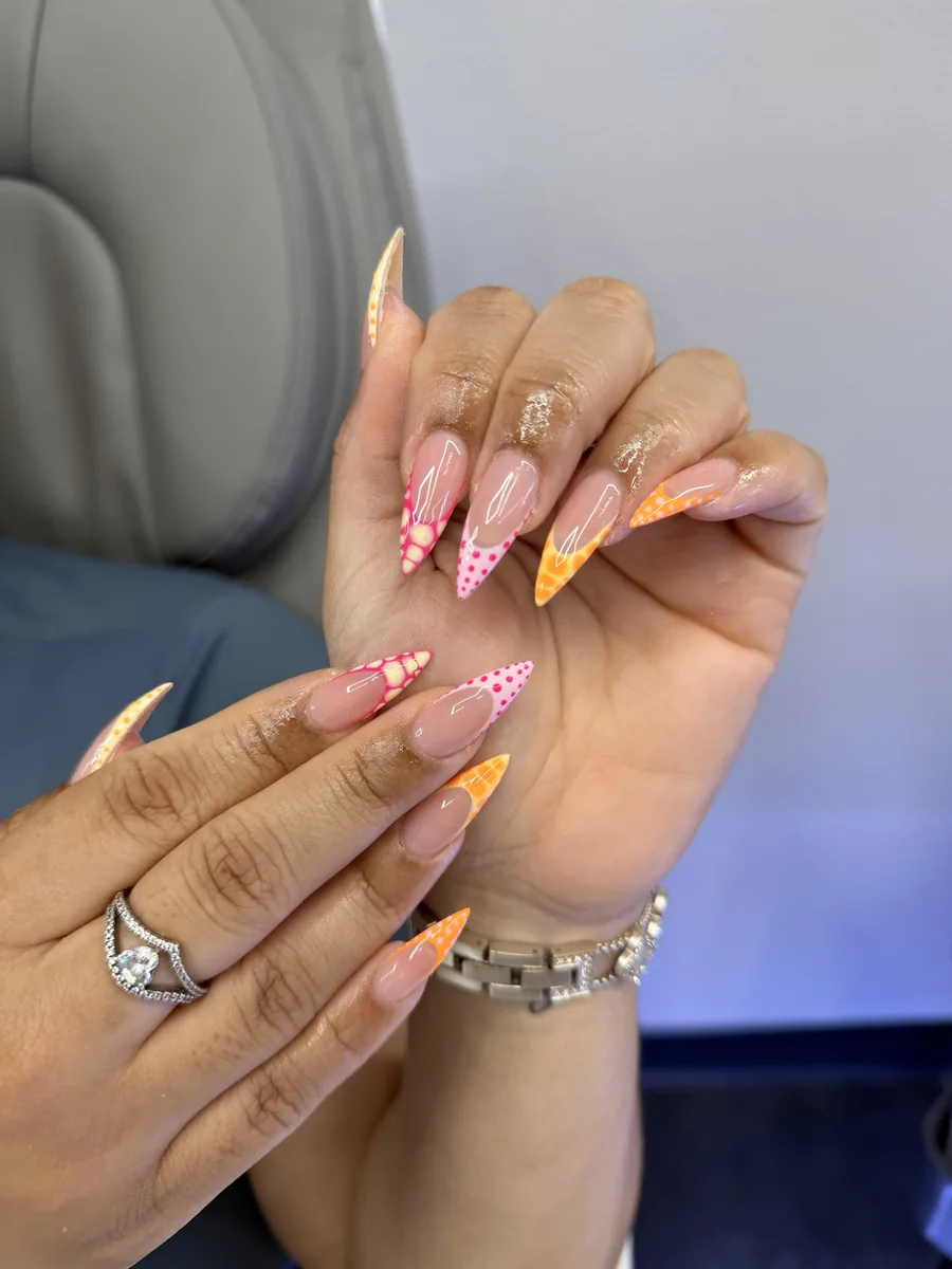 Pink and orange dotted French nails at Modish Nail Lounge Rancho Cucamonga