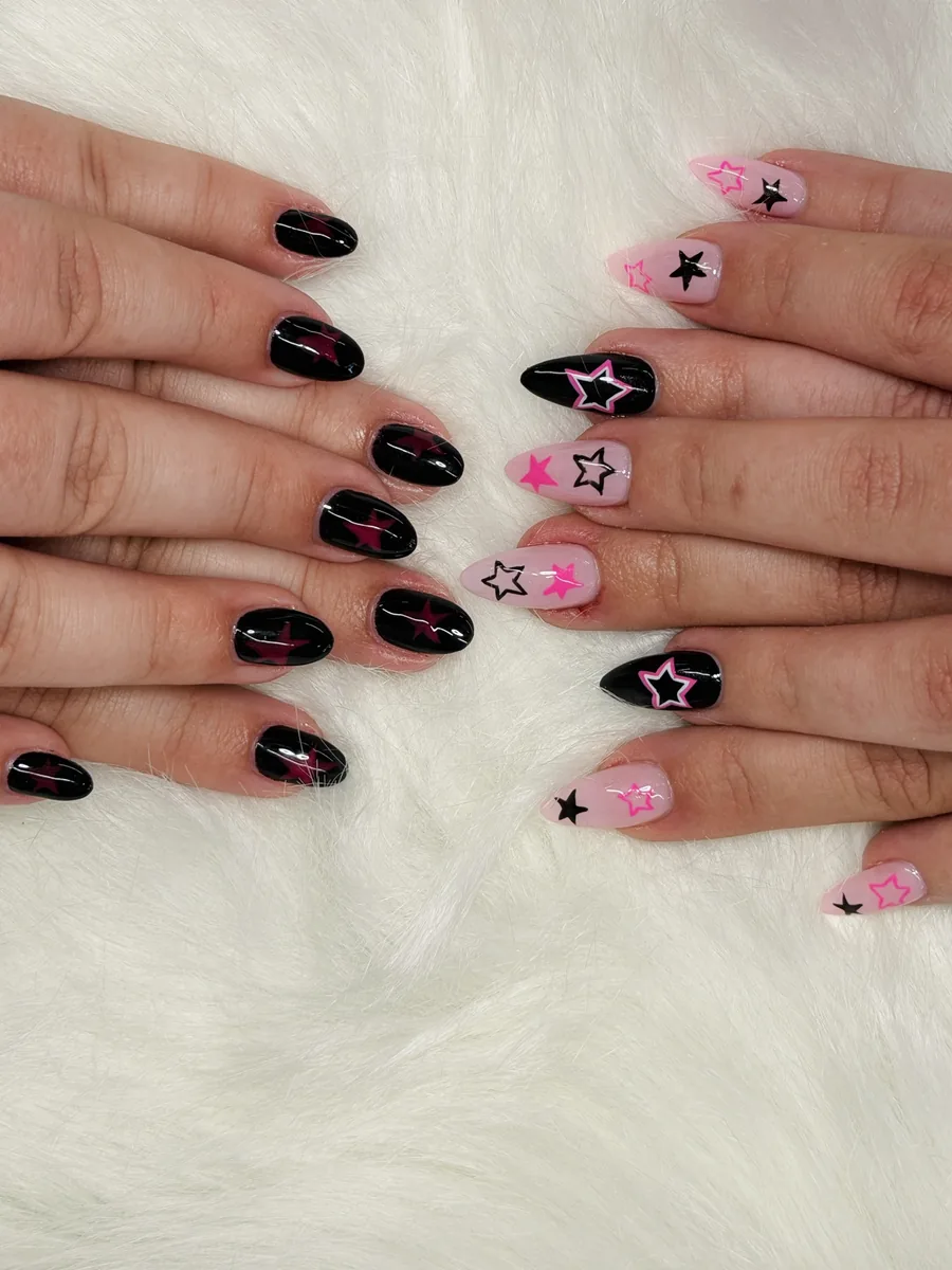 Black and pink set with star print accents nails at Modish Nail Lounge Rancho Cucamonga