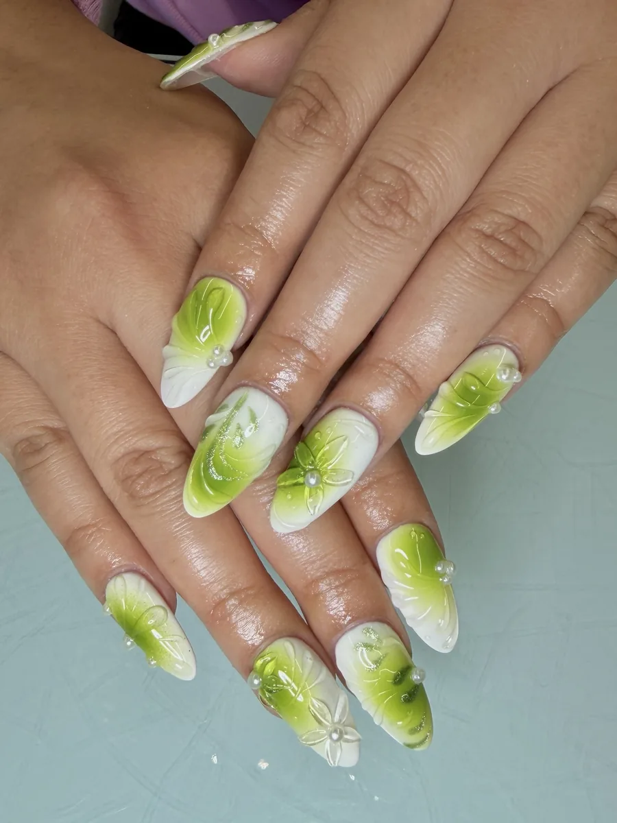 Green and white with 3D floral accents nails at Modish Nail Lounge Rancho Cucamonga