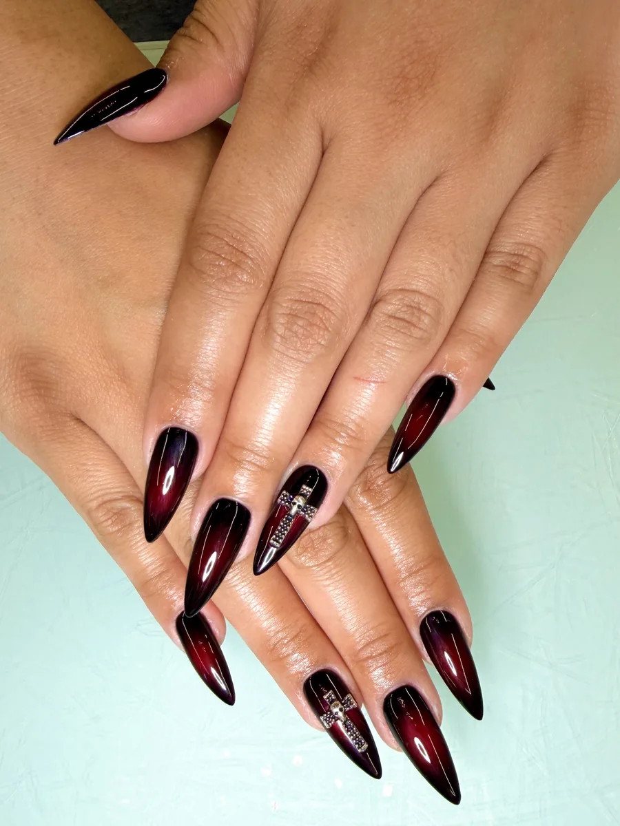 Dark cherry ombre stilettos with black tips nails at Modish Nail Lounge Rancho Cucamonga