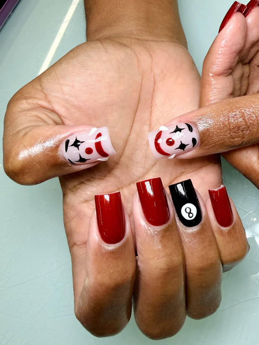 Deep red square set with playing-card art nails at Modish Nail Lounge Rancho Cucamonga