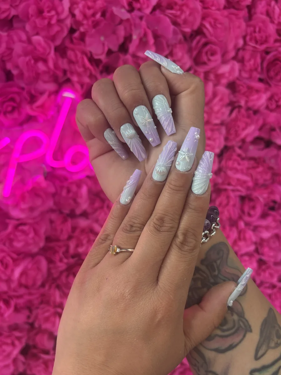 Pearl mermaid shells in iridescent white nails at Modish Nail Lounge Rancho Cucamonga