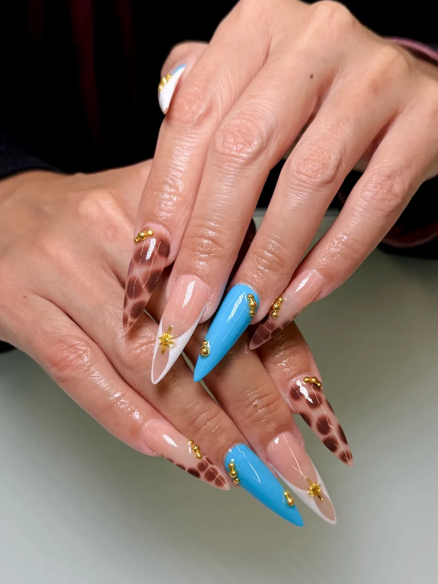 Tortoise, sky blue and nude mixed set nails at Modish Nail Lounge Rancho Cucamonga