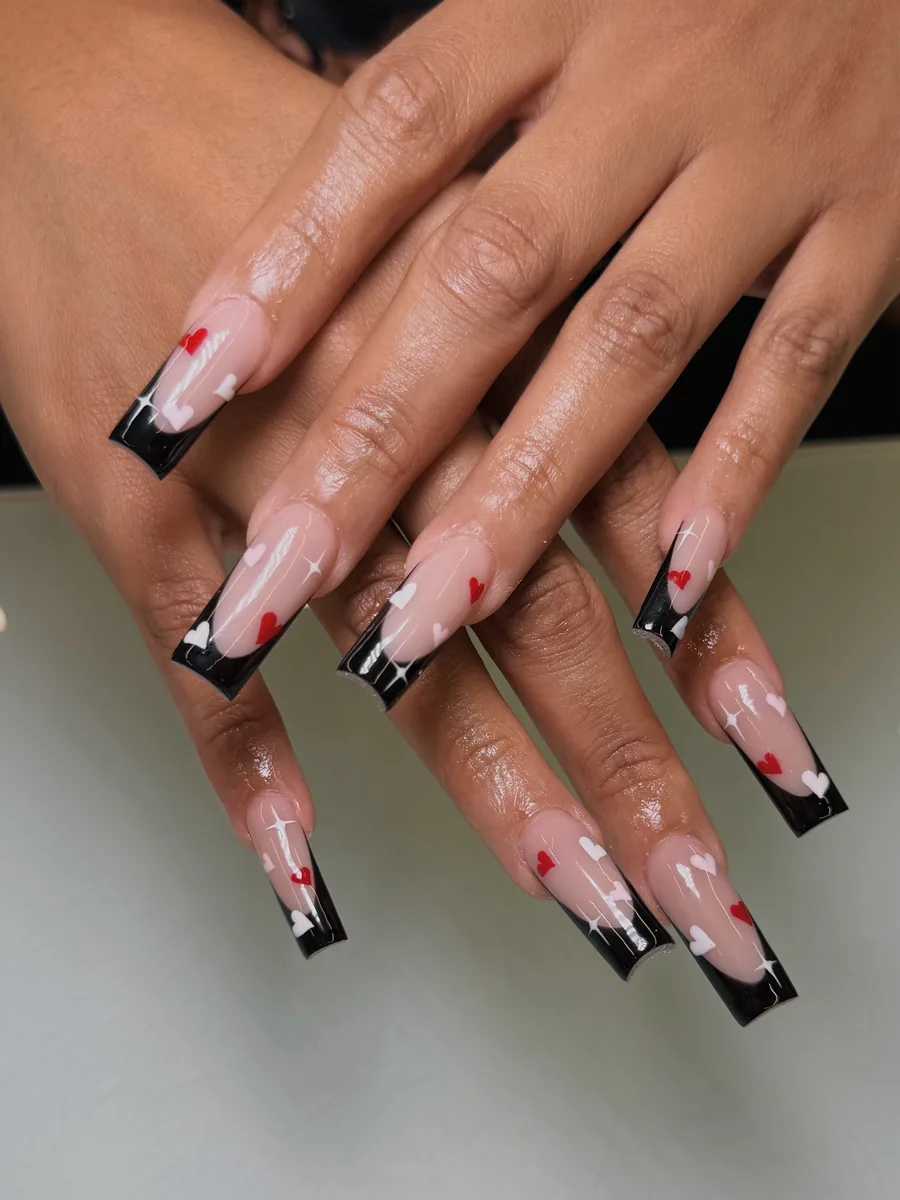 Black French with red accent nails nails at Modish Nail Lounge Rancho Cucamonga
