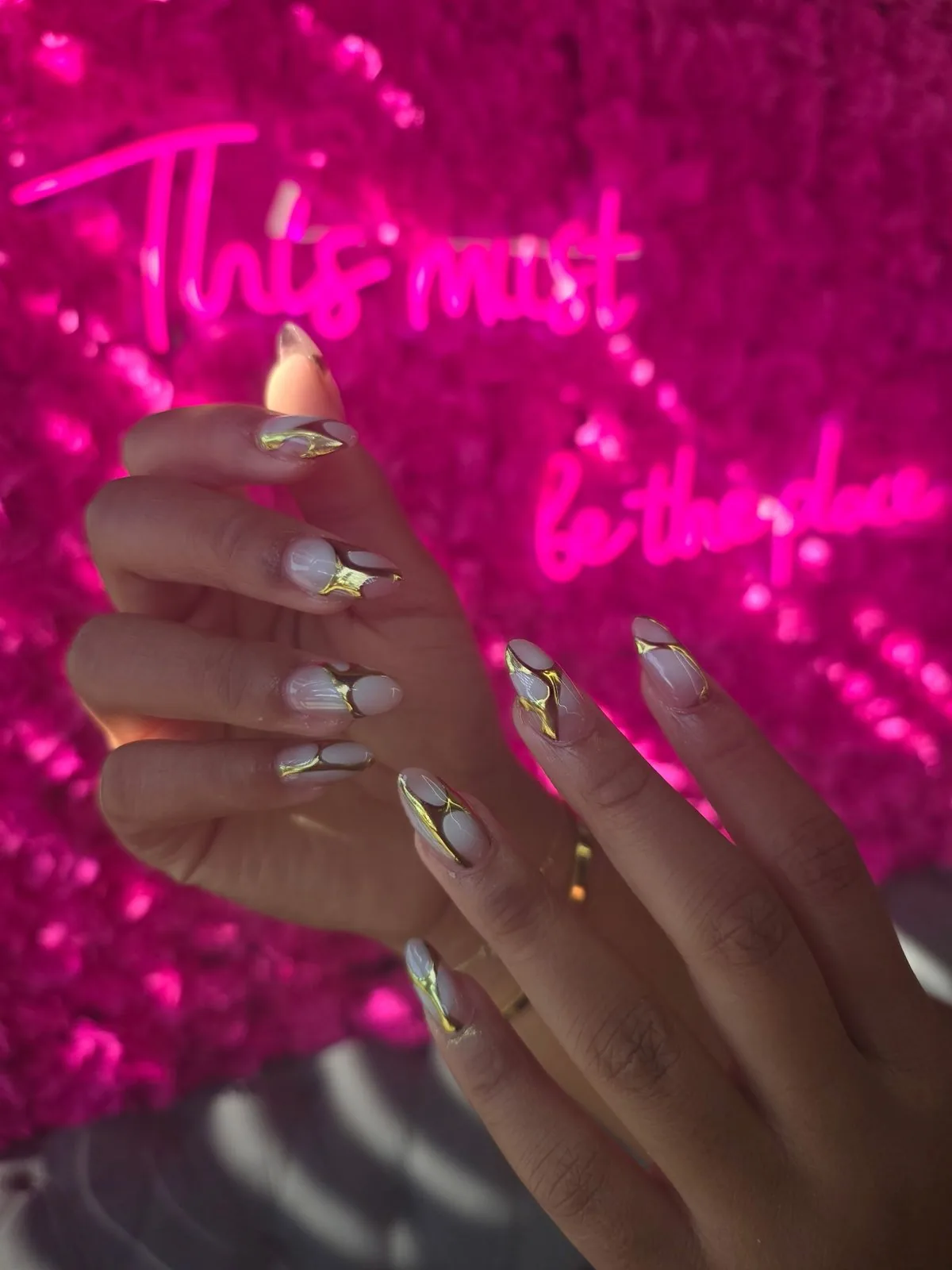 Gold swirl nails at Modish Nail Lounge Rancho Cucamonga